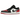 Air Jordan 1 Low Bred Toe 2.0 sneakers i en vinklad vy, med vita läderpaneler, röd tåbox, svart swoosh och en tålig gummisula för bra grepp.