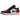Air Jordan 1 Low Bred Toe sneakers i sidoprofil med svart och röd läderovandel, vit mellansula och röd yttersula samt klassisk snörning.