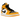 Air Jordan 1 Mid Taxi sneakers i vinklad vy med läderöverdel i gult och vitt, svart swoosh-logotyp och klassiska svarta skosnören