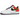 Nike Air Force 1 Low Raygun sneakers i en vinklad vy som visar den vita ovandelen, orangea och gula detaljer samt den ikoniska Swoosh
