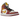 Air Jordan 1 Mid Dia de los Muertos sneakers i en detaljerad profilvy med mönstrad ovandel, gyllene detaljer och synliga sömmar