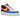 Nike Air Force 1 Low '07 QS Uno sneakers sedd från sidan med vit läderovandel, färgstarka paneler och röd sula med klassiskt swoosh-logo.