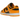 Nike Dunk Low Championship Goldenrod sneakers i en vinklad profil med gul och svart läderovandel, matchande sula och svarta skosnören.