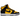 Nike Dunk High Retro Reverse Goldenrod sneakers sedd från sidan med gul ovandel, svarta läderdetaljer, matchande skosnören och vit gummisula