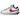 Nike Zoom Cortez SP sacai White University Red Blue sneakers i en vinklad profilvy med vit ovandel, röda detaljer och blå skosnören