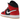 Air Jordan 1 Mid SE Christmas sneakers i vinklad profil med rödgröna detaljer, vita paneler och svart swoosh-logotyp på sidan