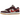 Nike SB Dunk Low Skate Like a Girl sneakers i en vinklad vy med mockadetaljer i vinrött, krämvit ovandel och gummisula