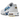 Nike Air Max Plus Spray Paint Swoosh White Blue sneakers i vinklad profil med vit mesh-ovandel, spraymålad blå Swoosh och ikonisk Tuned Air-sula.