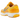 Nike Zoom Vomero 5 Yellow Ochre sneakers i vinklad profil med senapsgul ovandel, krämfärgad mellansula och grå detaljer på hälen