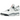 Air Jordan 4 Retro White Cement (2025) sneakers i profil med vit läderovandel, grå cementdetaljer på mellansulan och svart ikonisk Jumpman-logotyp.