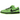 Nike SB Dunk Low The Powerpuff Girls Buttercup sneakers i en vinklad vy med grön ovandel i mocka, svarta skosnören och karakteristiska ögon på hälkappan.